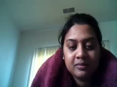 In front of a webcam, chubby dilettante Desi Fatso boasts about her enormous breasts.